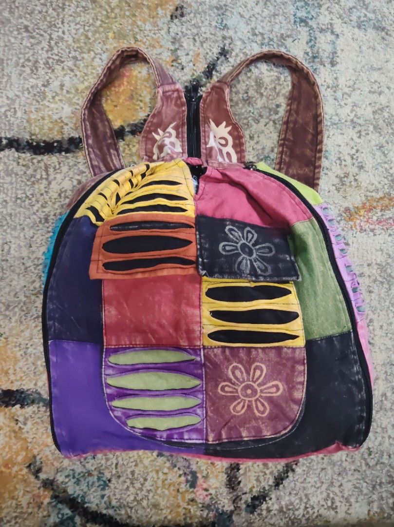 Boho Patchwork Backpack Bag (Category: Backpacks) located in Ipoh. Submitted by wajasstore (Listing ID 1447800903, Image 1). Description: - Funky patchwork backpack - Features colorful embroidered flowers and stripes - Zipper closure at the top - Adjustable straps for comfort - Ideal for everyday use or festivals - Unique and eye-catching design.
