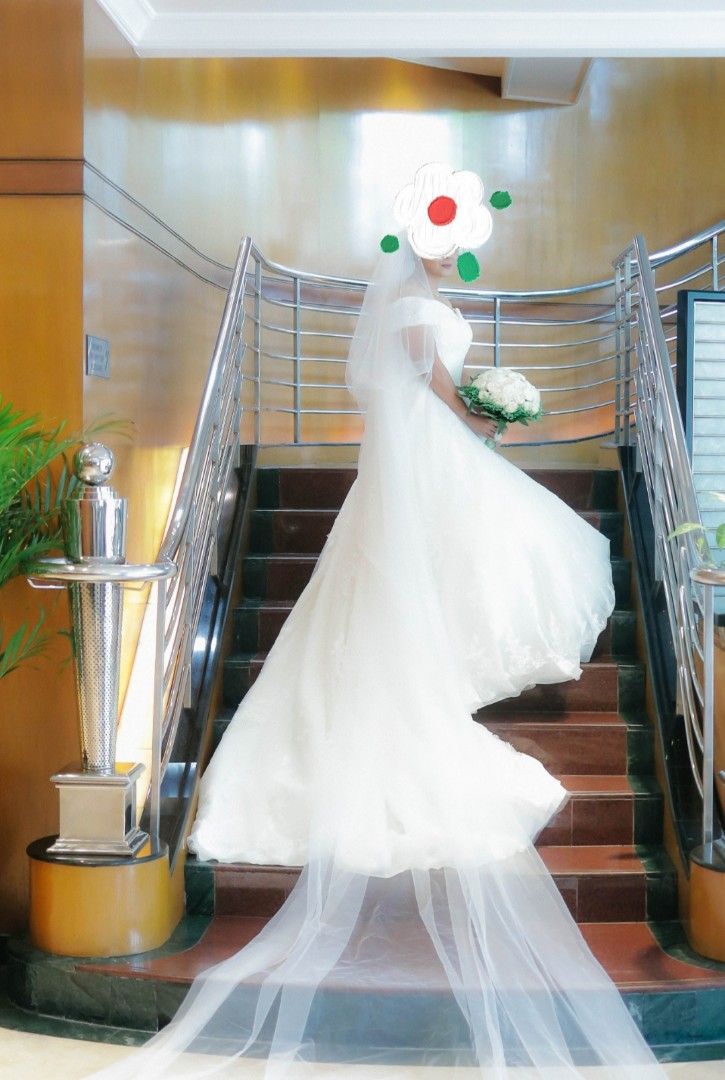 Bridal Gown (Category: Evening dresses & gowns) located in Taguig. Submitted by yogart (Listing ID 1447823501, Image 3). Description: Hello future bride. Wedding gown for sale used last year. Size: M-L Color: Off white Deaign: Corset back, long trail, ball gown (7 layers) Tahi ung sequins and embroidered not glued Condition: Used once good as new, dry cleaned Included: pertticoat With Box Bought this for 20k selling for 12k.