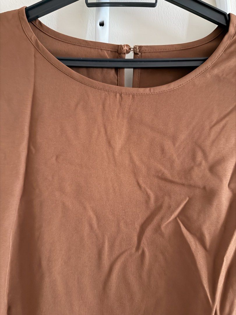 Brown Puff Sleeve Blouse with Back Button Detail (Category: Blouses) located in Kuala Lumpur. Submitted by jay_s (Listing ID 1447760421, Image 2). Description: - Elegant brown long-sleeve blouse - Stylish puff sleeves with elasticated cuffs - Classic round neckline - Convenient button closure at the back - Fabric with a subtle sheen Buy any 3pcs blouses for RM60.
