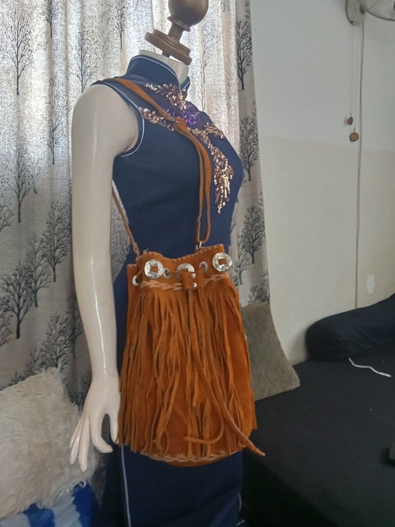 Brown Suede Fringe Bucket Bag (Category: Cross-body Bags) located in Caloocan City. Submitted by noy5o1a (Listing ID 1441816768, Image 3). Description: - Super cute brown suede bucket bag - Features lots of fringe detail all around - Drawstring closure with metal accents - Suede strap - Ideal for a boho or western vibe - Perfect size for essentials.