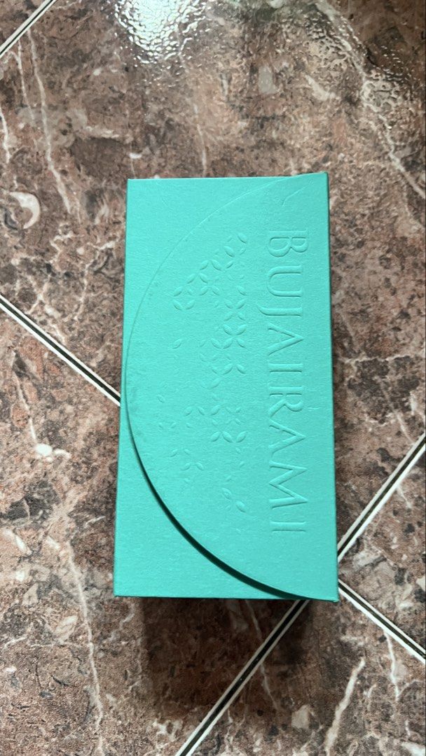 BUJAIRAMI Nonstop Perfume for Men (Category: Fragrance & Deodorants) located in Subang Jaya. Submitted by alternativel (Listing ID 1447748235, Image 2). Description: 99ml/100ml BUJAIRAMI Nonstop perfume in a teal bottle with a black cap. Beautiful teal box with embossed patterns. Great scent, selling because I have too many. Grab it now!.