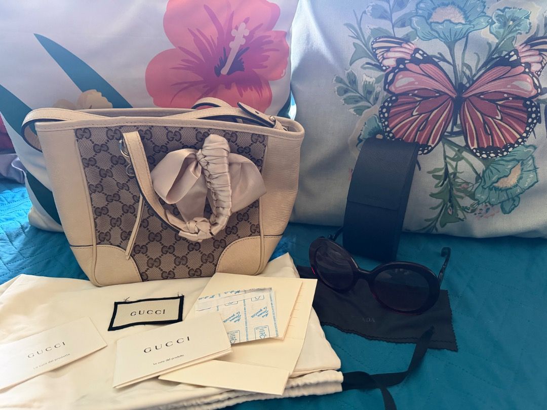 Bundle Gucci Bag and Prada Shades (Category: Luxury Bags & Wallets) located in Quezon City. Submitted by iamlm_0810 (Listing ID 1447718255, Image 3). Description: Model: Gucci Off-white/Beige Original GG Canvas Bree Top Handle Small Tote Gold-tone hardware Retailed for approximately $1,100 to 1,300 Bought in Spain Condition: Very Good Collection: Prada Minimal Baroque Original with code Color:Red-brown Made in Italy Sculpted Baroque-inspired temp