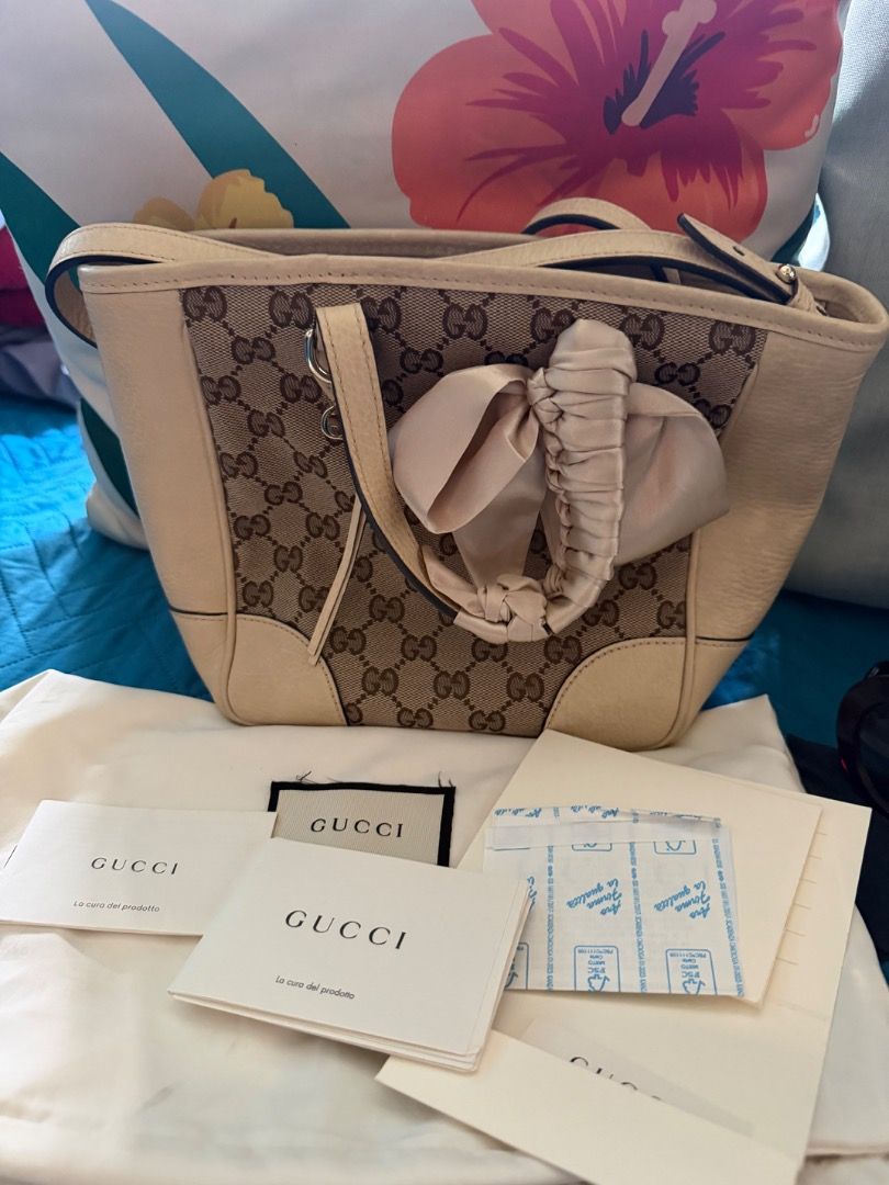 Bundle Gucci Bag and Prada Shades (Category: Luxury Bags & Wallets) located in Quezon City. Submitted by iamlm_0810 (Listing ID 1447718255, Image 2). Description: Model: Gucci Off-white/Beige Original GG Canvas Bree Top Handle Small Tote Gold-tone hardware Retailed for approximately $1,100 to 1,300 Bought in Spain Condition: Very Good Collection: Prada Minimal Baroque Original with code Color:Red-brown Made in Italy Sculpted Baroque-inspired temp