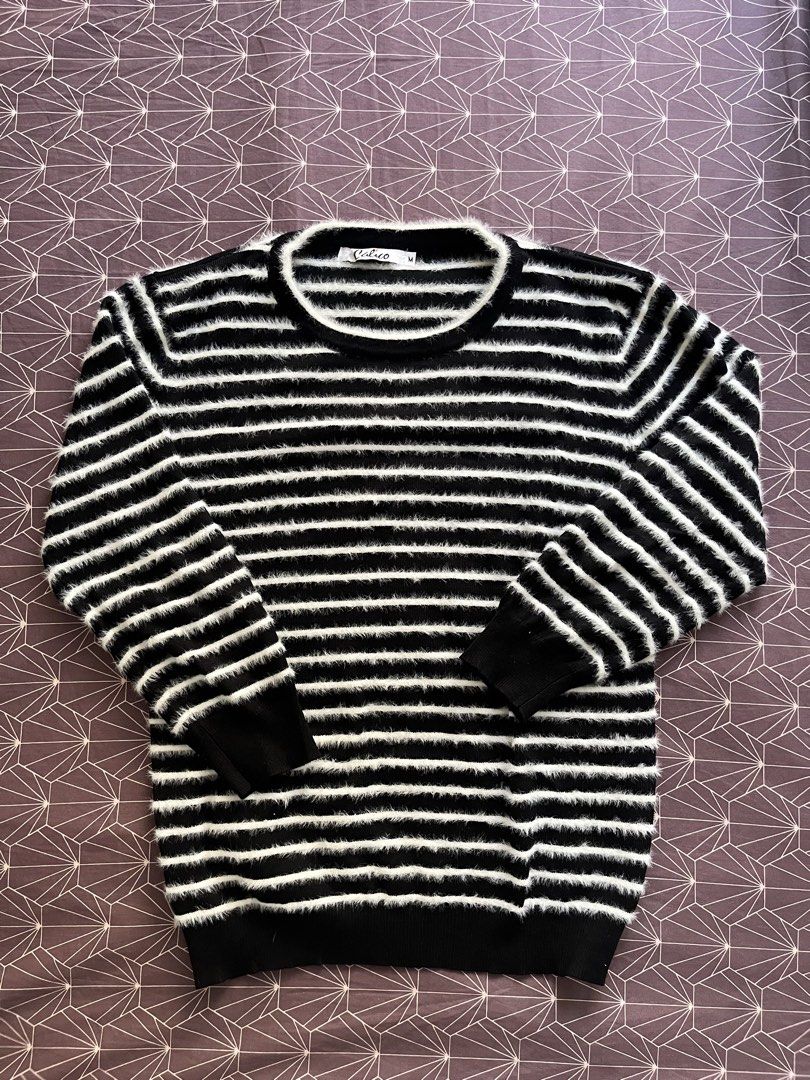 Calico Striped Fuzzy Sweater Size M (Category: Coats, Jackets and Outerwear) located in Manila. Submitted by jiden26 (Listing ID 1447757479, Image 1). Description: - Black and white striped fuzzy sweater - Brand: Calico - Style: Crew neck, long sleeves - Features: Ribbed cuffs and hem - Material: Soft and cozy - Versatile: Great for layering or wearing on its own - Easy to style with jeans or skirts.