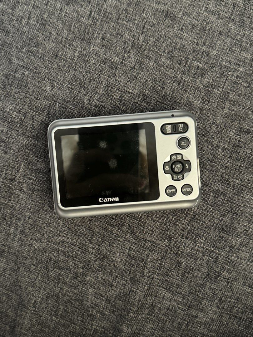 Canon Powershot A800 Silver Digicam Digital Camera (Category: Cameras) located in Cainta. Submitted by maecaroon (Listing ID 1447713298, Image 2). Description: CANON POWERSHOT A800 (Feel free to DM) HONEST ISSUES: *Middle button pad doesn’t work *Ghost touching *No cover on the cable outlet side (see slide 5) *Minimal dust on LCD (See slide 2, doesn’t affect output) Other than that, it works great! Issues can be fixed. ⭐️Working Flash ⭐️Clear LCD