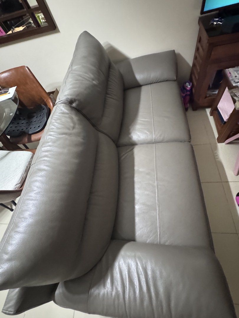 Charles 2-Seater Sofa - Taupe Grey Leather (Category: Sofas) located in Taguig. Submitted by aaltabano (Listing ID 1447784826, Image 2). Description: - Charles 2-seater sofa - Material: leather - Features: Plush, pillow-like seats and arms - Frame: Supported by sleek metal legs - Color: Versatile taupe grey - Dimensions: W178 x D95 x H86 cm - Ideal for: Any living space 2-seater leather sofa in mint condition, well maintained with leather conditi