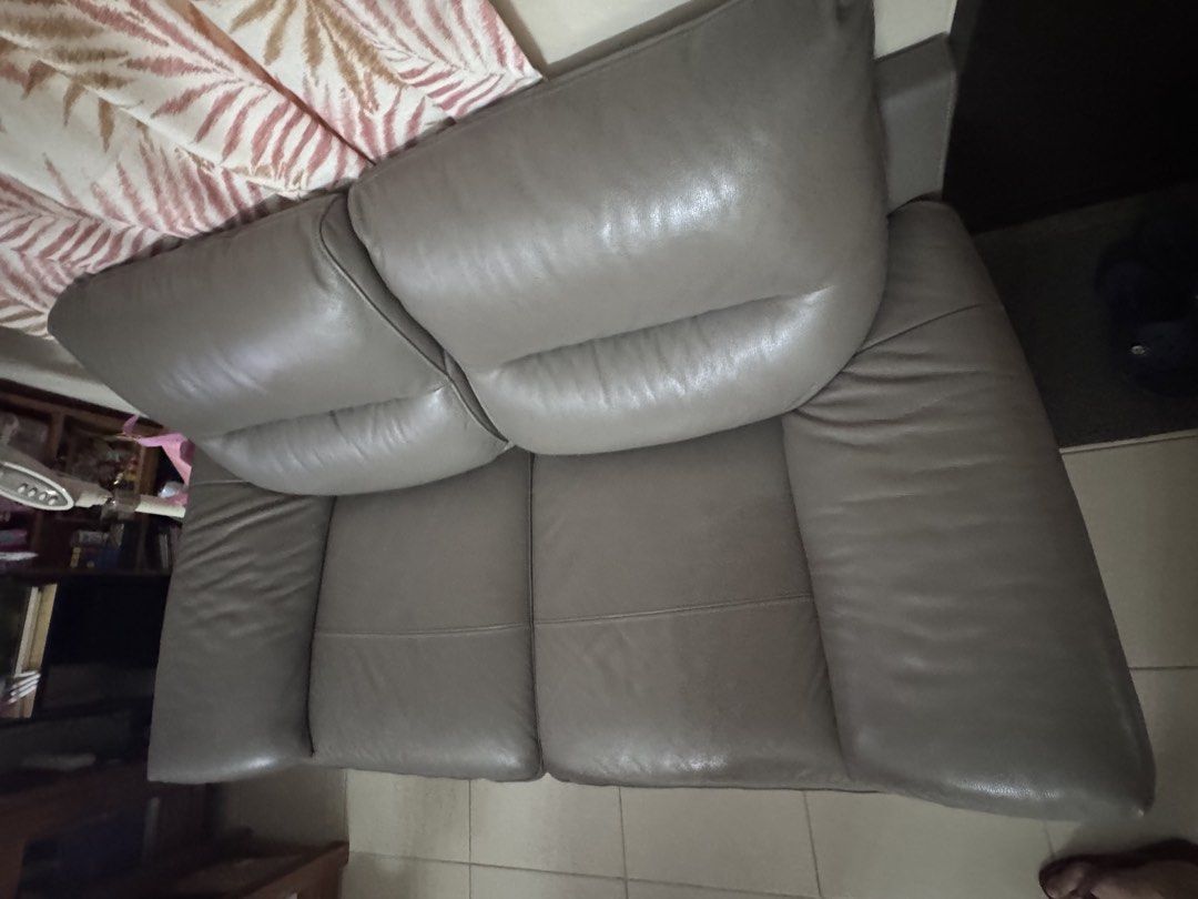 Charles 3-Seater Sofa - Taupe Grey Leather (Category: Sofas) located in Taguig. Submitted by aaltabano (Listing ID 1447786902, Image 3). Description: - Charles 3-seater sofa - Upholstered in taupe grey leather - Plush, pillow-top seats and arms for ultimate comfort - Modern, sleek metal legs - Stylish and comfortable addition to any living room - Dimensions: W209 x D95 x H86 cm 3-seater leather sofa in mint condition, well maintained with leather