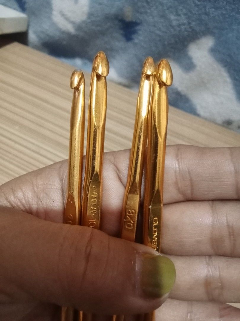 Clover Crochet Hooks Set - Gold Metal (Category: Craft Supplies & Tools) located in Bocaue. Submitted by marajapansurplus (Listing ID 1447726320, Image 2). Description: - Set of 4 Clover crochet hooks - Sizes: 1.5mm, 1.75mm, 2.0mm, 2.25mm - Gold metal finish - Authentic Clover brand from Japan - Ideal for detailed crochet projects - One hook has minor signs of use, but all are fully functional.