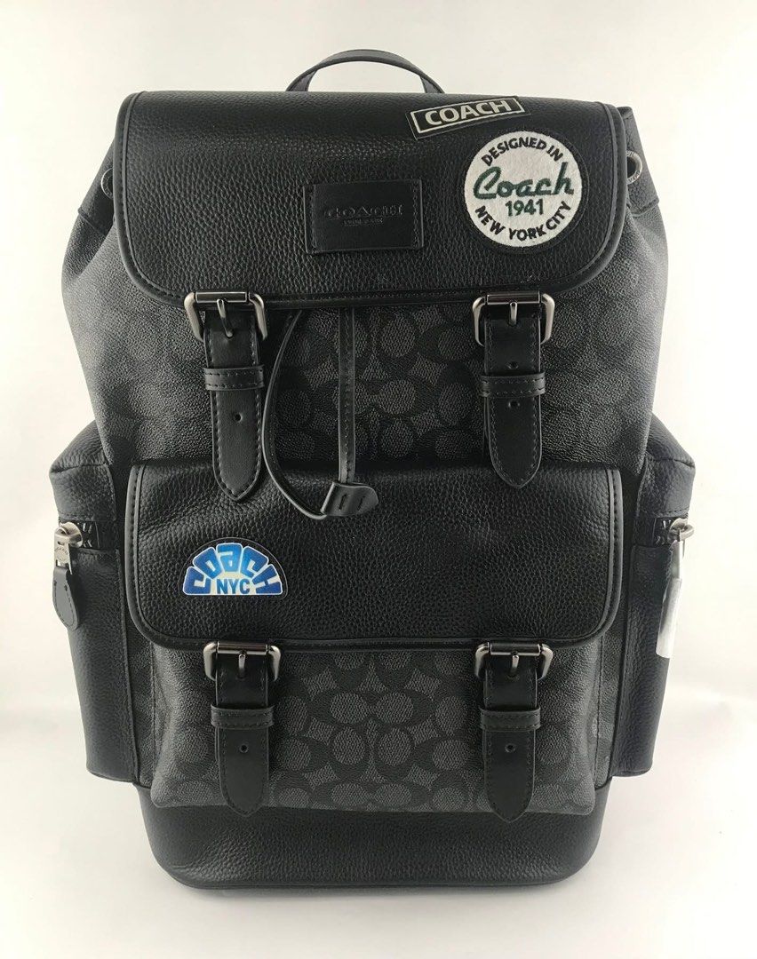Coach Signature Backpack with Patches (Category: Backpacks) located in Caloocan City. Submitted by brandeditemsph (Listing ID 1447853859, Image 2). Description: - Coach signature print backpack - Color: Black and Grey - Multiple patches on front and side - Drawstring closure under flap - Buckle closures on front pockets - Side zip pockets - Padded straps for comfort - Ideal for everyday use or travel.