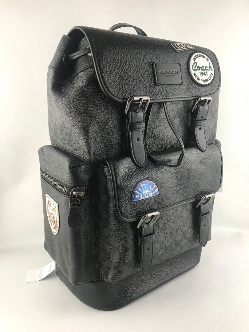 Coach Signature Backpack with Patches (Category: Backpacks) located in Caloocan City. Submitted by brandeditemsph (Listing ID 1447853859, Image 3). Description: - Coach signature print backpack - Color: Black and Grey - Multiple patches on front and side - Drawstring closure under flap - Buckle closures on front pockets - Side zip pockets - Padded straps for comfort - Ideal for everyday use or travel.