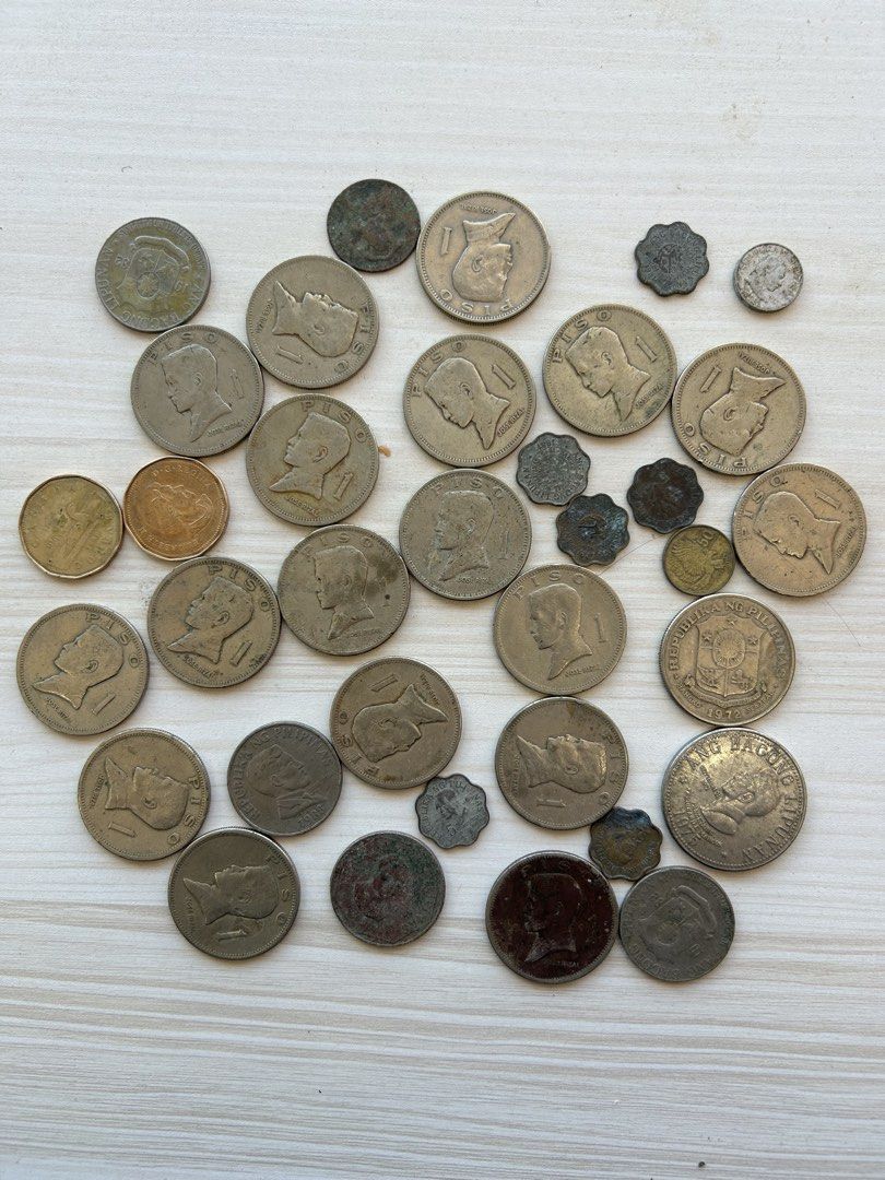 Collection of Assorted Old Coins (Category: Currency) located in Manila. Submitted by mystic_mikki (Listing ID 1447684536, Image 1). Description: - Collection of old coins - Includes US currency (possibly Kennedy half dollars) - Includes foreign coins (possibly Philippine markings) - Ideal for coin collectors and numismatics enthusiasts - Sold as a single lot.