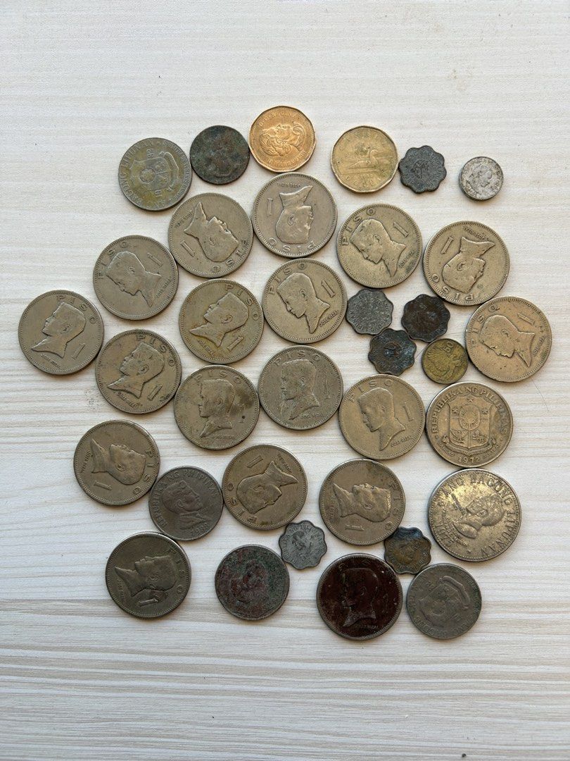 Collection of Assorted Old Coins (Category: Currency) located in Manila. Submitted by mystic_mikki (Listing ID 1447684536, Image 2). Description: - Collection of old coins - Includes US currency (possibly Kennedy half dollars) - Includes foreign coins (possibly Philippine markings) - Ideal for coin collectors and numismatics enthusiasts - Sold as a single lot.