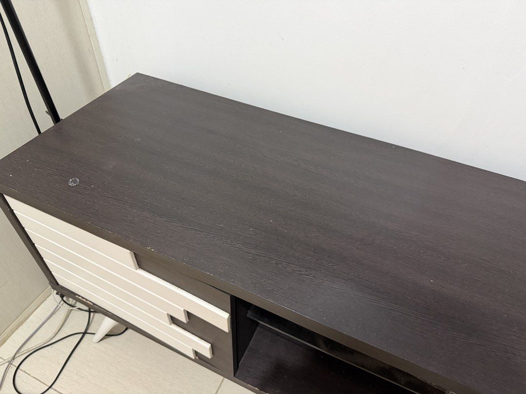 Console Table (Category: TV Consoles) located in Las Pinas. Submitted by shoptav (Listing ID 1447835331, Image 3). Description: Dimensions (approx.): * Length: 140 cm * Depth: 40 cm * Height: 77 cm * Used but still in good and sturdy condition. * No major flaws or structural issues. * One decorative white panel has come loose (shown in the photos) and just needs to be glued back in place. * Minor signs of wear from normal use. Price still negotia