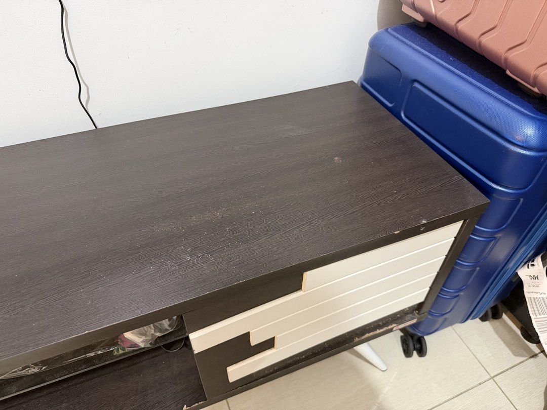 Console Table (Category: TV Consoles) located in Las Pinas. Submitted by shoptav (Listing ID 1447835331, Image 2). Description: Dimensions (approx.): * Length: 140 cm * Depth: 40 cm * Height: 77 cm * Used but still in good and sturdy condition. * No major flaws or structural issues. * One decorative white panel has come loose (shown in the photos) and just needs to be glued back in place. * Minor signs of wear from normal use. Price still negotia