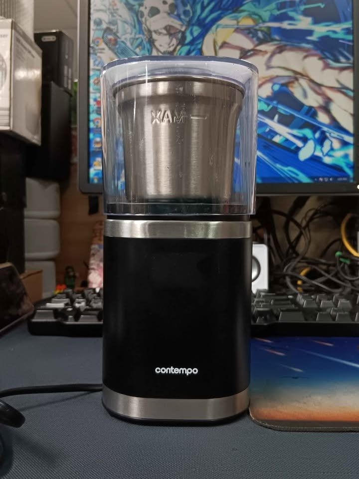 Contempo Coffee Grinder CG9411-SA (Category: Coffee Machines & Makers) located in Pasay City. Submitted by enrico_appliances (Listing ID 1447822797, Image 2). Description: - Contempo Coffee Grinder - Stainless steel interior and blades for durability - Powerful 150W motor for efficient grinding - Perfect for coffee beans and spices - Simple one-touch operation - Easy to clean - Compact and space-saving design - Note: Do not immerse in water - 85 