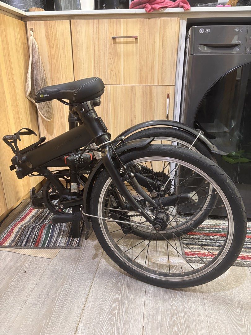 Dahon Route 20” Alloy Folding Bike (Category: Bicycles) located in Antipolo. Submitted by marcabeni_fox (Listing ID 1447696172, Image 3). Description: - Black folding bicycle - Equipped with mudguards on both wheels - Handlebars feature a bell and reflector - Comes with a chain lock - Easy to fold and store - Ideal for commuting or leisure rides - Ready for your next adventure!.