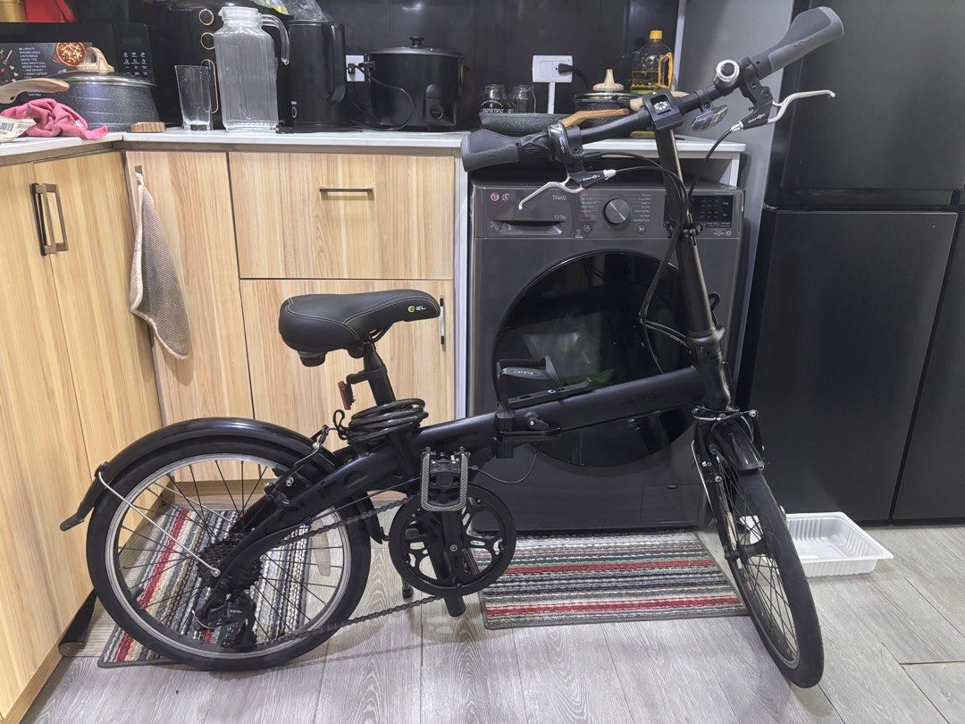 Dahon Route 20” Alloy Folding Bike (Category: Bicycles) located in Antipolo. Submitted by marcabeni_fox (Listing ID 1447696172, Image 1). Description: - Black folding bicycle - Equipped with mudguards on both wheels - Handlebars feature a bell and reflector - Comes with a chain lock - Easy to fold and store - Ideal for commuting or leisure rides - Ready for your next adventure!.