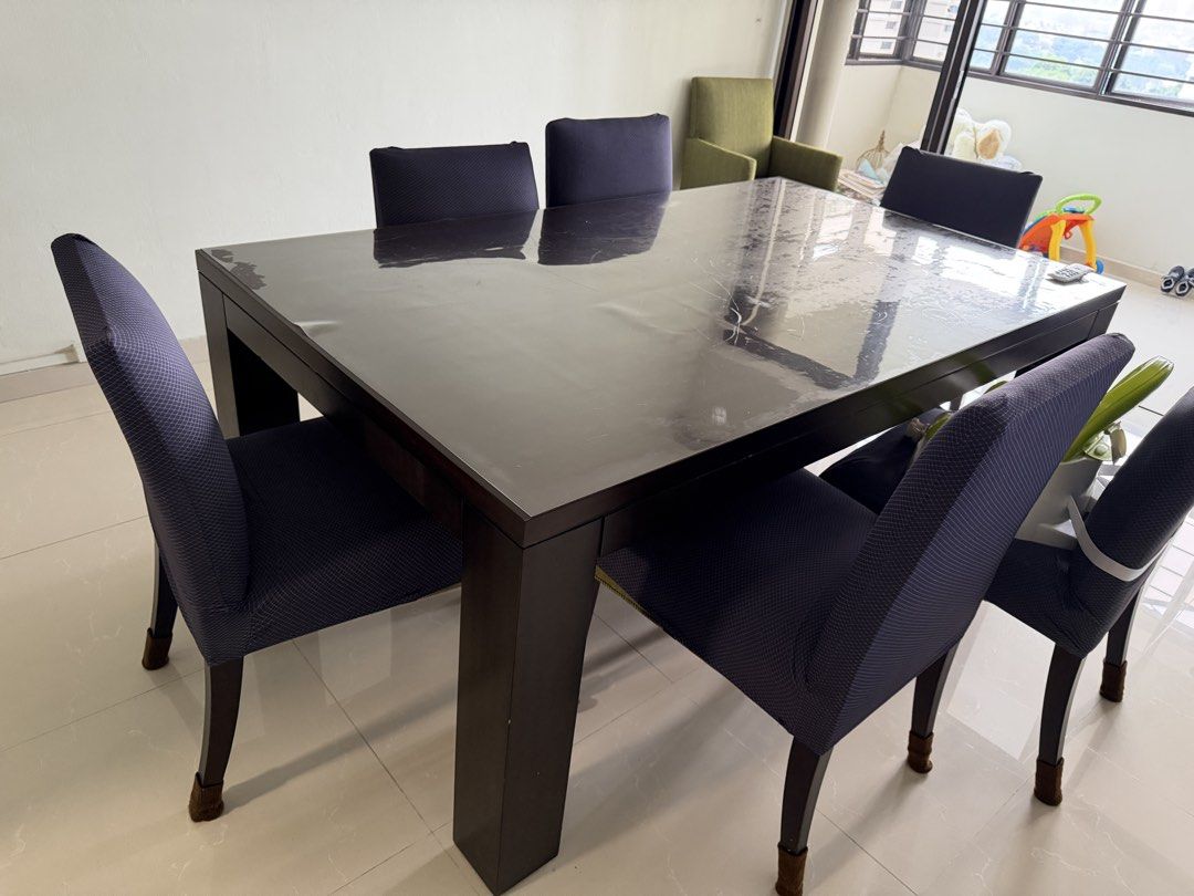Dark Solid Wood Dining Table (Category: Tables & Sets) located in Singapore. Submitted by jackang (Listing ID 1447757021, Image 1). Description: - Dark wood dining table - quality Solid wood - Comfortable seating for family meals and gatherings. Need to sell as moving house and doesn’t fit new decor - self pickup.