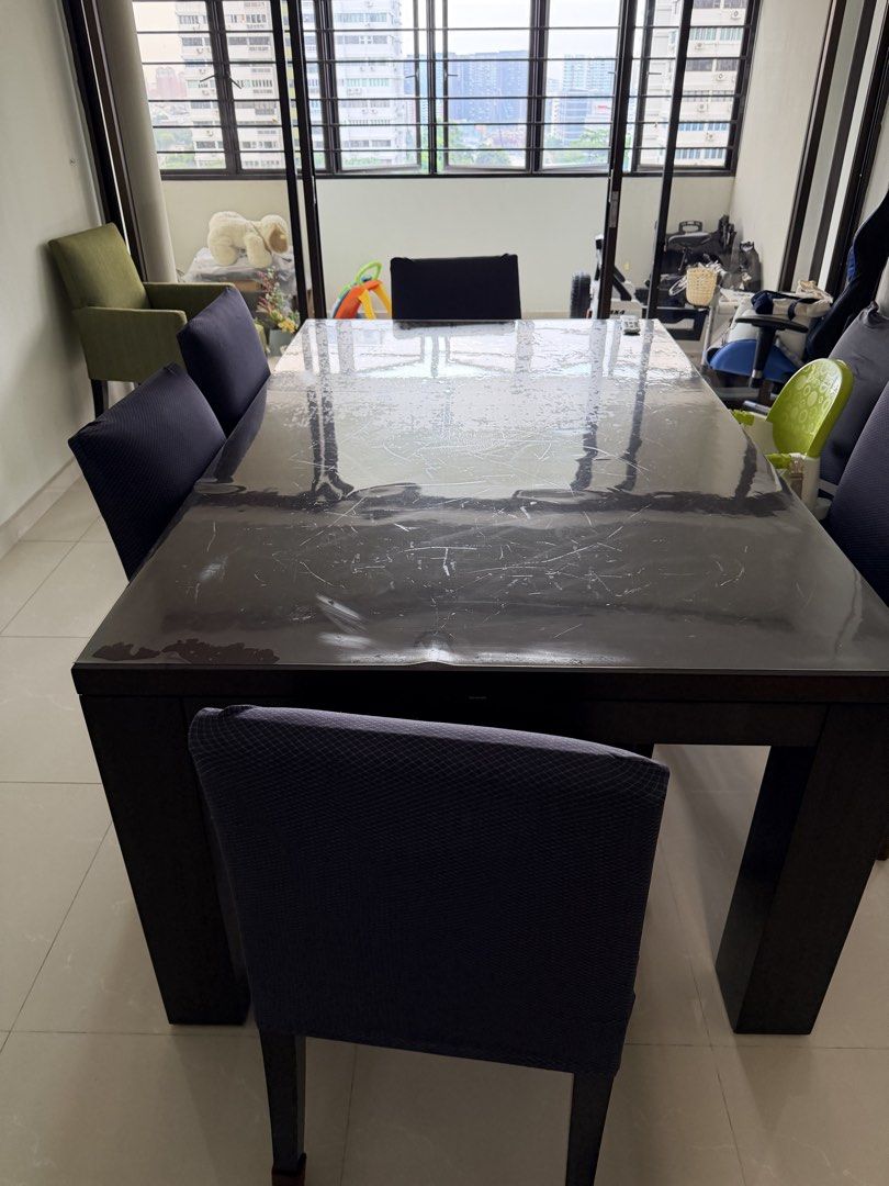 Dark Solid Wood Dining Table (Category: Tables & Sets) located in Singapore. Submitted by jackang (Listing ID 1447757021, Image 3). Description: - Dark wood dining table - quality Solid wood - Comfortable seating for family meals and gatherings. Need to sell as moving house and doesn’t fit new decor - self pickup.