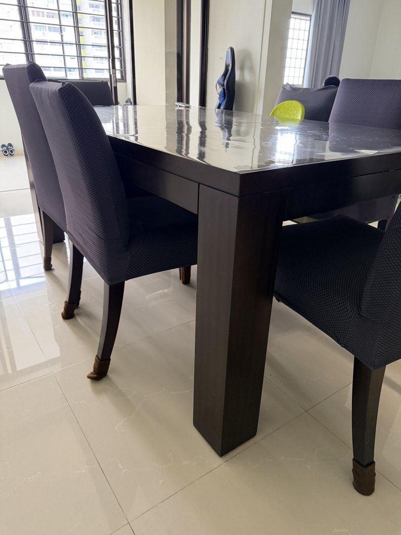 Dark Solid Wood Dining Table (Category: Tables & Sets) located in Singapore. Submitted by jackang (Listing ID 1447757021, Image 2). Description: - Dark wood dining table - quality Solid wood - Comfortable seating for family meals and gatherings. Need to sell as moving house and doesn’t fit new decor - self pickup.