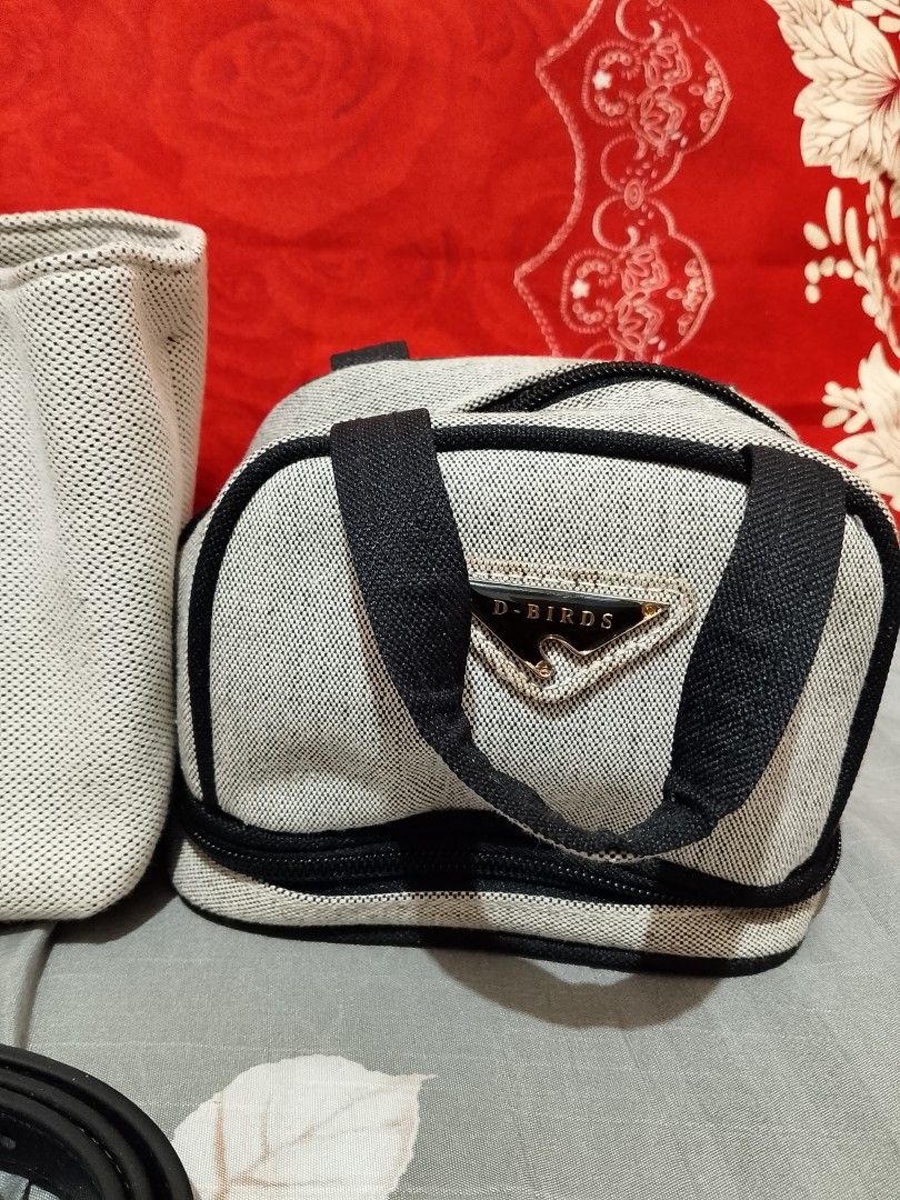 D-BIRDS Canvas Tote Bag with Pouch and Strap (Category: Tote Bags) located in Manila. Submitted by youngdragon.0d29ca (Listing ID 1447799895, Image 3). Description: - Stylish canvas tote bag with black handles and trim. - Includes a matching zippered pouch featuring the D-BIRDS logo. - Detachable shoulder strap for versatile carrying options. - Ideal for everyday errands or your next travel adventure. - Brand new with tag attached..