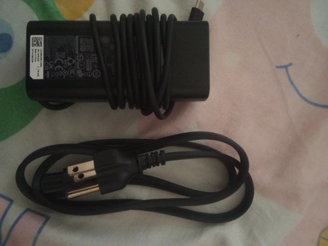 Dell original 65watts type c (Category: Chargers) located in Taguig. Submitted by carlsab (Listing ID 1447703898, Image 1). Description: DELL laptop charger TYPE C 65WATTS BRAND NEW.