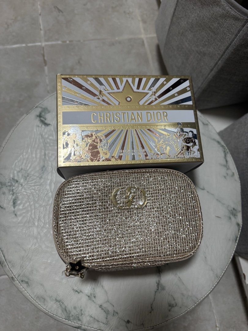 Dior make up bag (Category: Luxury Bags & Wallets) located in Quezon City. Submitted by AnjRawa (Listing ID 1447796180, Image 1). Description: - Sparkly gold Christian Dior cosmetic bag - Features iconic CD logo - Comes with a festive, starry design box - Ideal for storing makeup or travel essentials - Bag interior is empty.