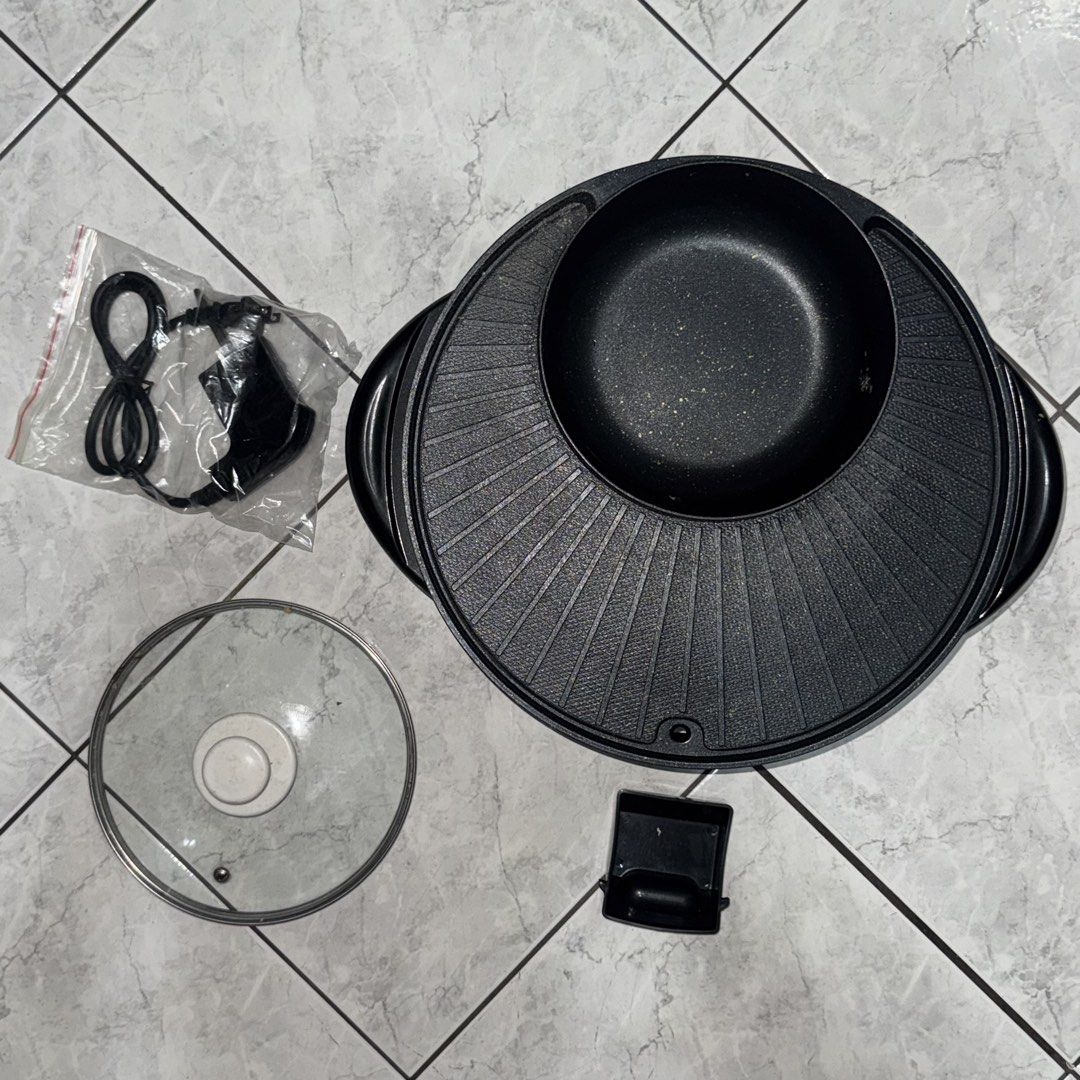 Electric Multifunction Hotpot and Grill Pan set (Category: Cookware & Accessories) located in Manila. Submitted by batoygonz19661 (Listing ID 1447742292, Image 2). Description: - Versatile 2-in-1 Electric Hotpot and Grill Pan - Ideal for Shabu-Shabu, Grilling, and various dishes - Features a separate section for soup/broth - Includes a glass lid and power cord - User-friendly and easy to clean - Perfect for family meals and gatherings.