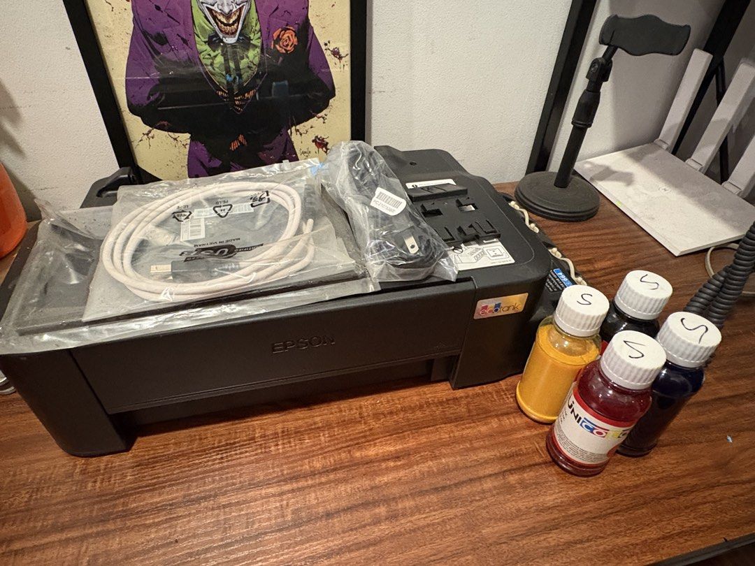 Epson L121 Sublimation/Pigment ink converted (Category: Printers, Scanners & Copiers) located in Quezon City. Submitted by nadz.b (Listing ID 1447799101, Image 2). Description: - Brand new - Includes USB cable and power cord - With 4 bottles of sublimation ink - Still with original box - Ready for a new home.