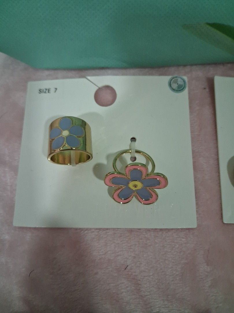 Forever 21 Chokers, Rings, and Necklaces Set (Category: Necklaces) located in Manila. Submitted by beardedbot (Listing ID 1447717216, Image 2). Description: - Bundle of cute jewelry perfect for accessorizing! - Includes 2 Forever 21 chokers: one braided strap, one delicate chain. - Set of 2 flower rings (size 7). - Pair of daisy rings. - Multi-strand necklace with charms and tassels. -bundle or per piece accepted -accepting offer.