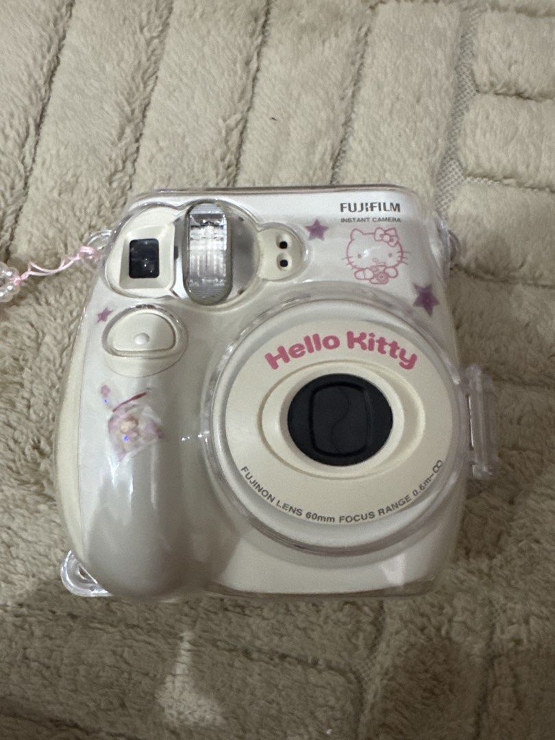 Fujifilm Limited Edition Hello Kitty Instax Mini 7 (free case & charm) (Category: Cameras) located in Quezon City. Submitted by matchaislove (Listing ID 1447797505, Image 1). Description: - WORKING - Fujifilm Instax Mini 7 Limited Edition - 'Hello Kitty' text on the lens - Includes a stylish pink beaded strap.