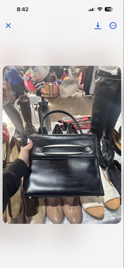 Gianni Versace Black Leather Top Handle Bag (Category: Luxury Bags & Wallets) located in Manila. Submitted by selling_everything_anything (Listing ID 1447805248, Image 3). Description: - Classic black leather handbag - Gianni Versace brand - Sleek design with silver hardware accents - Top handle for carrying - Interior features 'Gianni Versace Made in Italy' label - Timeless and stylish piece - Suitable for daily use or special occasions.
