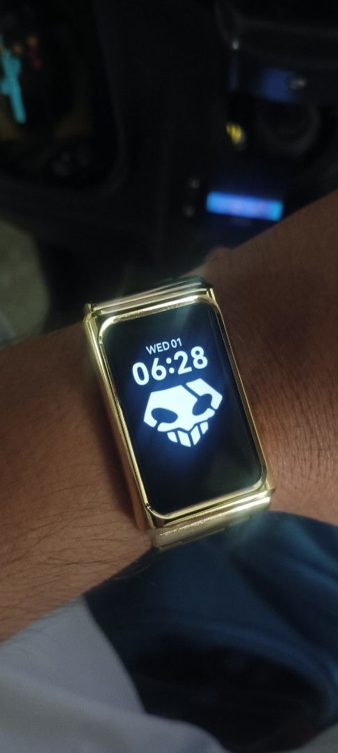 Gold Smart Band with Custom Watch Face (Category: Wearables & Smart Watches) located in Mandaluyong City. Submitted by aykalbano (Listing ID 1447682186, Image 1). Description: Gold Smart Band with time, date, and a cool skull watch face. Sleek, modern, and works perfectly. Great for fitness tracking or as a stylish accessory..