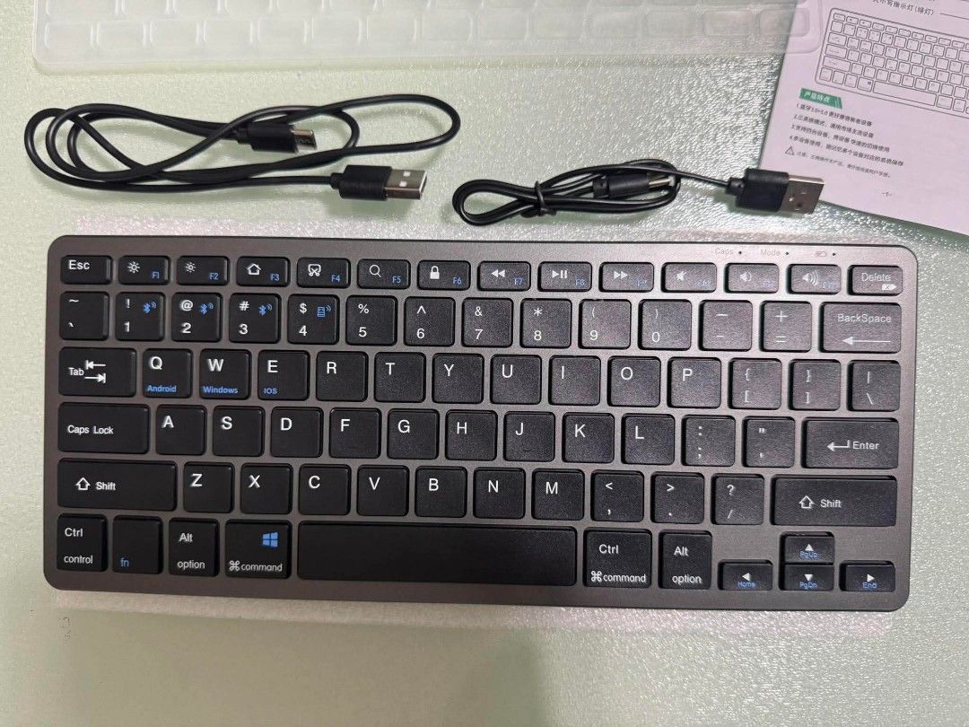 GOOJODOQ Wireless Bluetooth Keyboard (Pre-Loved) (Category: Computer Keyboard) located in San Juan City. Submitted by jenteria10 (Listing ID 1447791961, Image 3). Description: - Slim and compact wireless keyboard - Connects easily via Bluetooth - Includes USB charging cable - Compatible with Android, Windows, and iOS devices - Ideal for seamless switching between multiple devices.