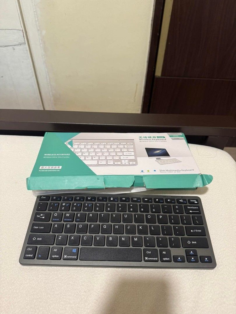 GOOJODOQ Wireless Bluetooth Keyboard (Pre-Loved) (Category: Computer Keyboard) located in San Juan City. Submitted by jenteria10 (Listing ID 1447791961, Image 2). Description: - Slim and compact wireless keyboard - Connects easily via Bluetooth - Includes USB charging cable - Compatible with Android, Windows, and iOS devices - Ideal for seamless switching between multiple devices.