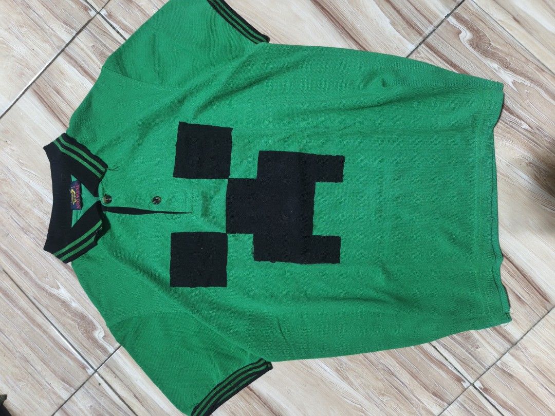Green Minecraft Creeper Polo T-shirt (Category: Tshirts & Polo Shirts ) located in Manila. Submitted by sourceph (Listing ID 1447726268, Image 1). Description: Green polo with big Minecraft creeper face design.(free size idk? kinda Large~) Black T-shirt with live leak design. (S-M) Red shirt with.. a cool design. (L-XL) Brown domo short. (L-XL) 300 each, take all 1k nlng btw lahat yan hand painted ah.