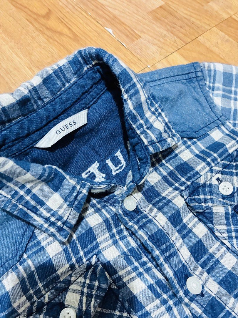 Guess Blue Plaid Denim Shirt (Category: Tshirts & Polo Shirts ) located in Quezon City. Submitted by grai25 (Listing ID 1447810756, Image 2). Description: - Blue and white plaid long-sleeved shirt - Stylish denim accents on collar and shoulders - Classic button-up front - Two convenient chest pockets - Estimated size 10 - Ideal for everyday casual wear.