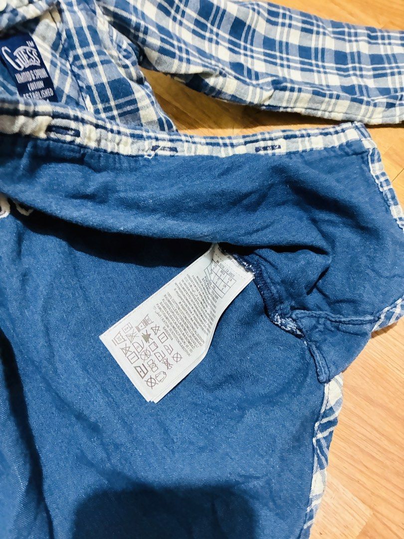 Guess Blue Plaid Denim Shirt (Category: Tshirts & Polo Shirts ) located in Quezon City. Submitted by grai25 (Listing ID 1447810756, Image 3). Description: - Blue and white plaid long-sleeved shirt - Stylish denim accents on collar and shoulders - Classic button-up front - Two convenient chest pockets - Estimated size 10 - Ideal for everyday casual wear.