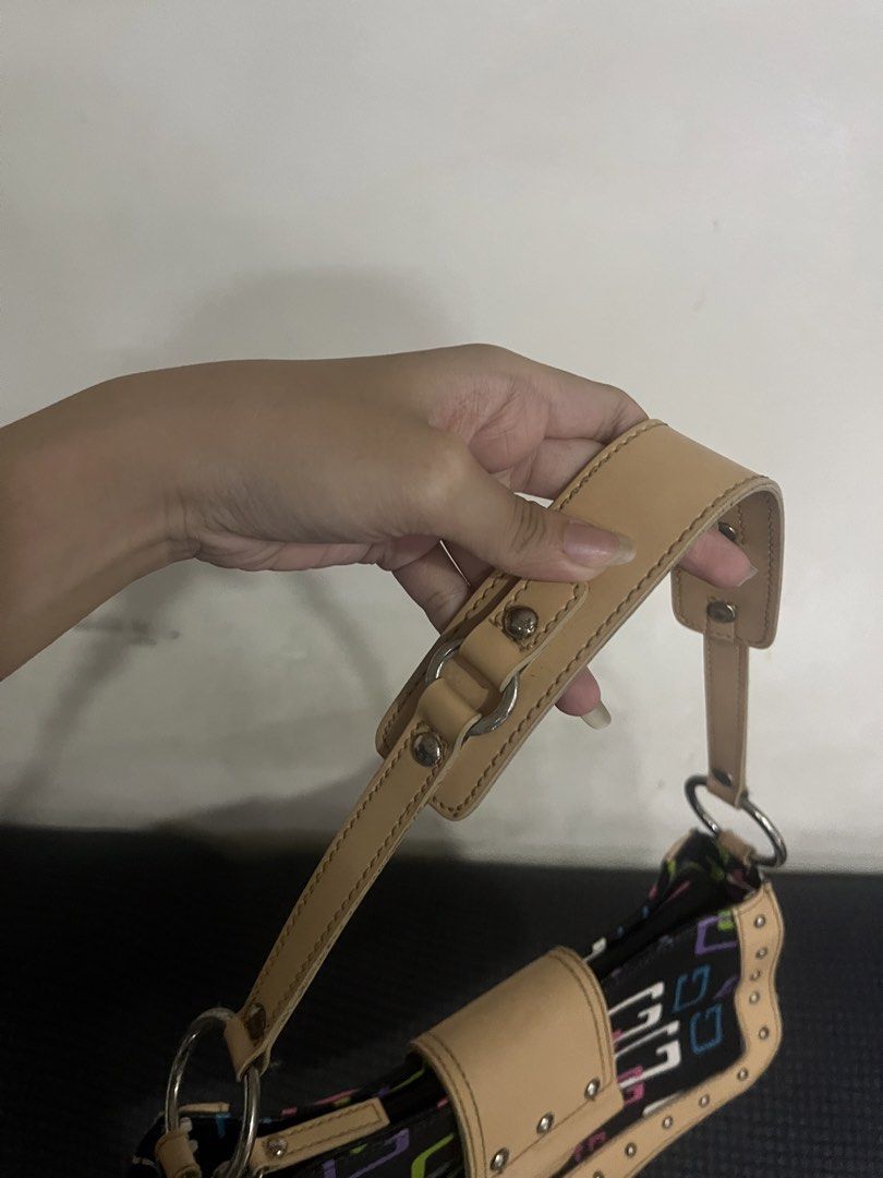 Guess Shoulder Bag - Black with Multi-Color G Logo (Category: Shoulder Bags) located in Manila. Submitted by declutbyal (Listing ID 1447749309, Image 3). Description: - Cute Guess shoulder bag - Black with iconic multi-colored G logo (pink, green, blue) - Tan trim and studded details - Adjustable strap for comfortable wear - Perfect for everyday use.