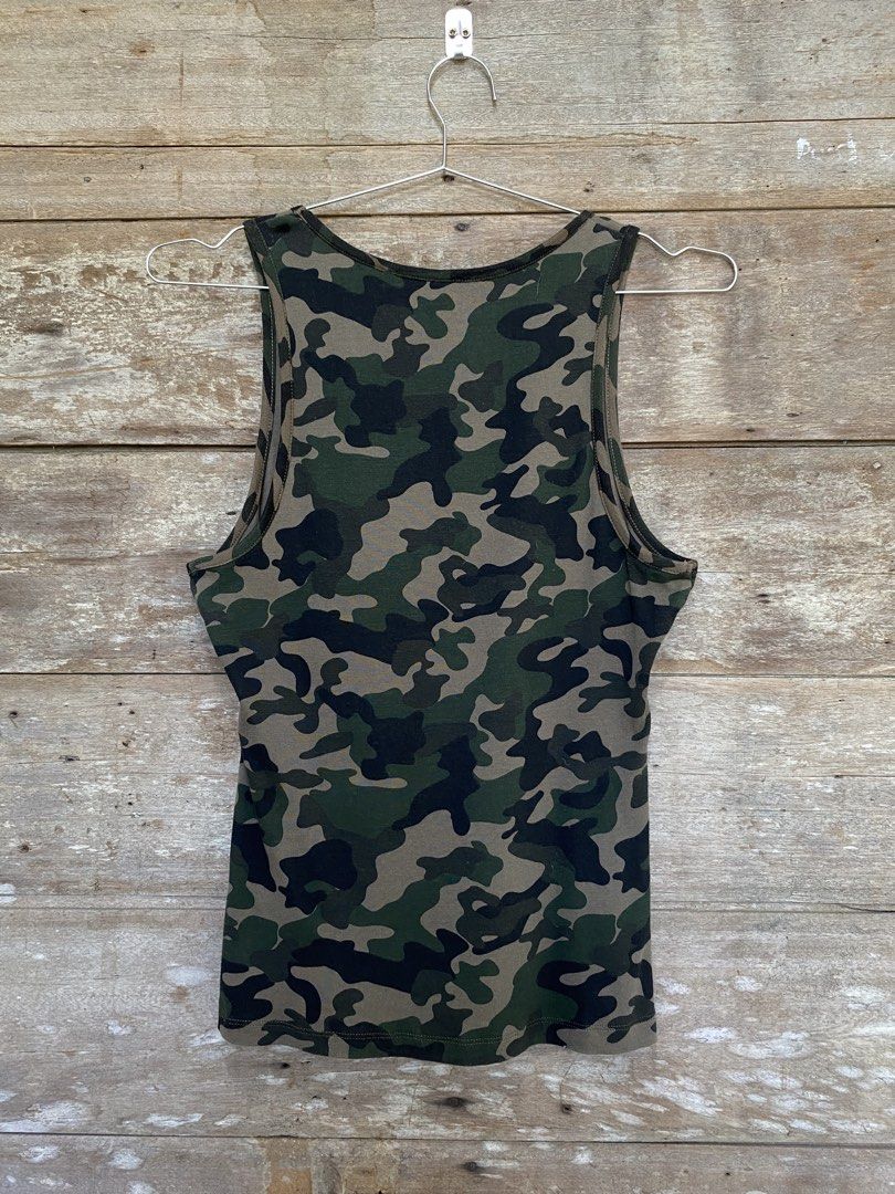 Guess Sleeveless Top (Category: Sleeveless) located in Bayombong. Submitted by fliptique (Listing ID 1447806135, Image 2). Description: Guess Camouflage Sleeveless Top Excellent Condition Size : XL Dimes : 16.5”x23.5” Shoulder To Shoulder : 11” Hem : 17” Color Rate : 10 Issue : ❌❌❌ 450 + sf Nueva Vizcaya Loc Hit a message if interested .