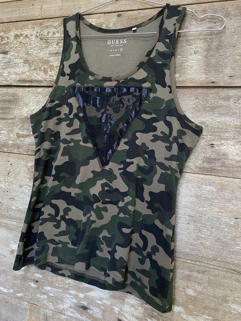Guess Sleeveless Top (Category: Sleeveless) located in Bayombong. Submitted by fliptique (Listing ID 1447806135, Image 3). Description: Guess Camouflage Sleeveless Top Excellent Condition Size : XL Dimes : 16.5”x23.5” Shoulder To Shoulder : 11” Hem : 17” Color Rate : 10 Issue : ❌❌❌ 450 + sf Nueva Vizcaya Loc Hit a message if interested .