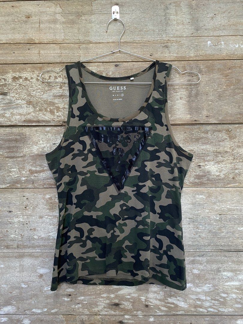Guess Sleeveless Top (Category: Sleeveless) located in Bayombong. Submitted by fliptique (Listing ID 1447806135, Image 1). Description: Guess Camouflage Sleeveless Top Excellent Condition Size : XL Dimes : 16.5”x23.5” Shoulder To Shoulder : 11” Hem : 17” Color Rate : 10 Issue : ❌❌❌ 450 + sf Nueva Vizcaya Loc Hit a message if interested .