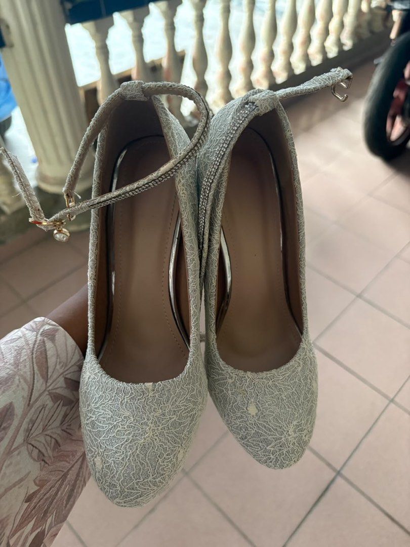 Heel Nikah Sanding (Category: Heels) located in Shah Alam. Submitted by missnoh (Listing ID 1447790952, Image 3). Description: Beli tapi tak pernah pakai. COD KLANG- KAMPUNG DELEK Silver Lace Platform Heels with Ankle Strap- Elegant silver lace heels - Features a stylish platform sole - Sparkly ankle strap for a secure and glamorous fit - Comfortable chunky heel, perfect for dancing - Ideal for parties, weddings, and special occasions - Sold as a