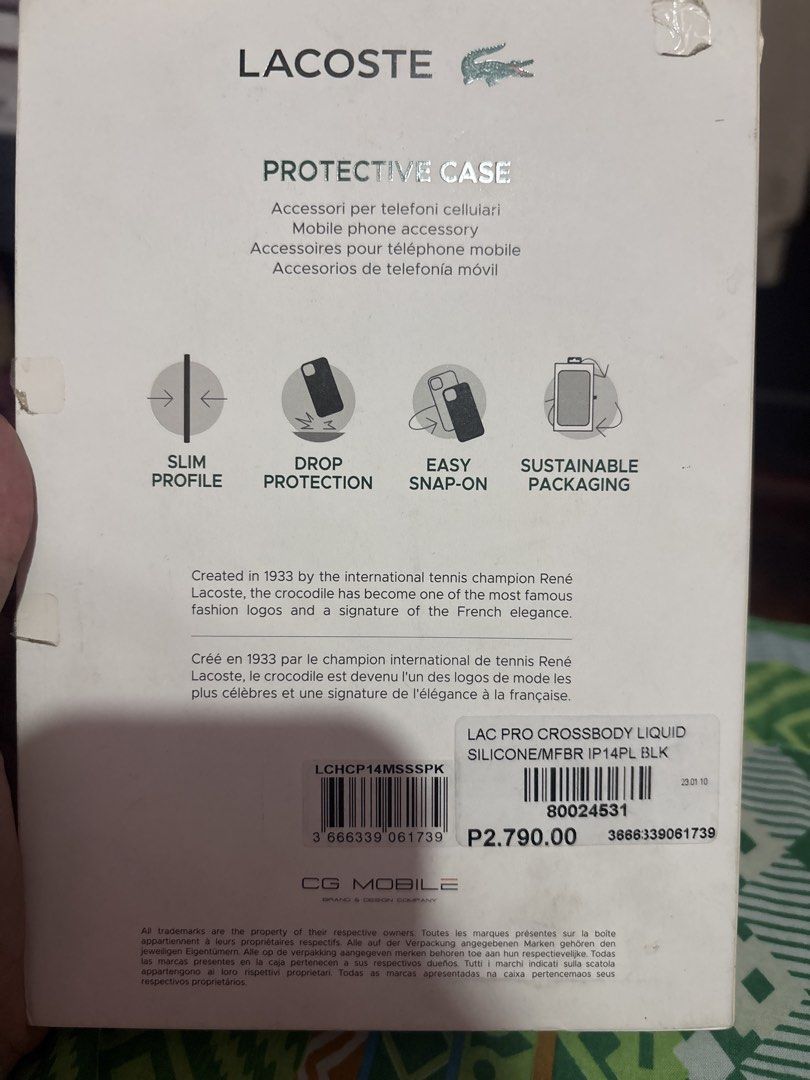 Lacoste iPhone 14 plus Case with Strap (Category: Cases & Sleeves) located in Manila. Submitted by lorainelouise (Listing ID 1447786915, Image 2). Description: - Brand New - The dents is from the plastic cover not the case.