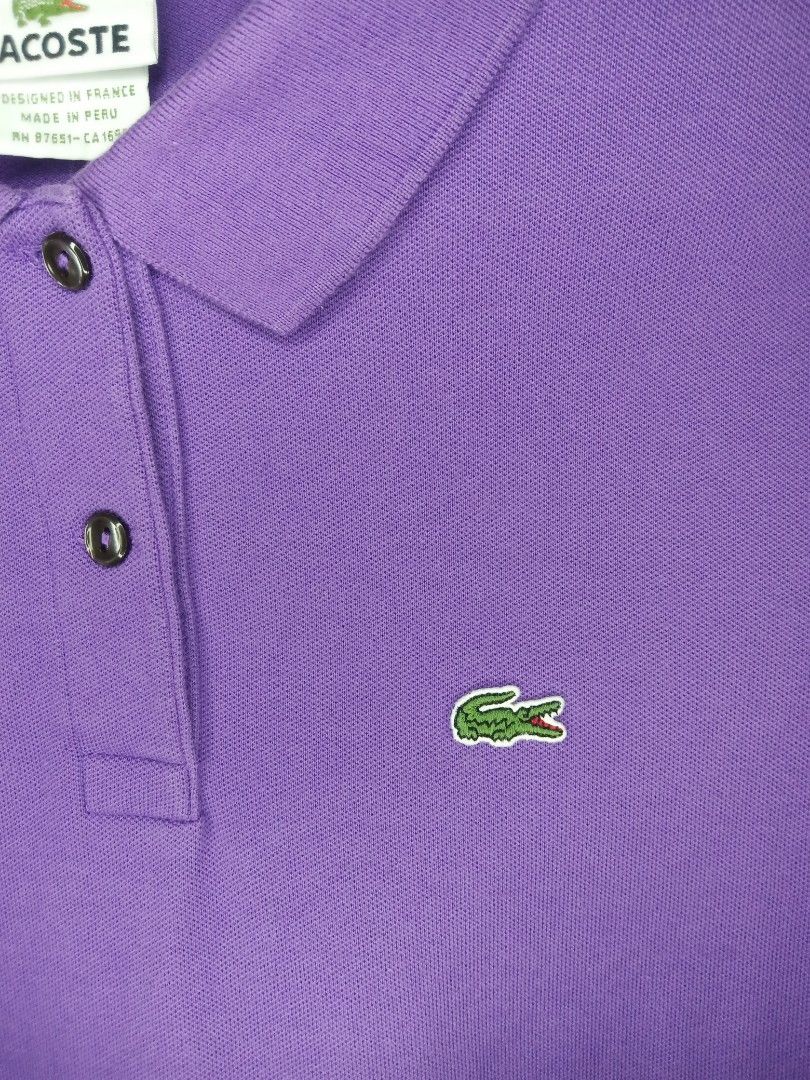 Lacoste Purple Polo Shirt (Category: Activewear) located in Tanay. Submitted by jrgoods (Listing ID 1447755769, Image 2). Description: - Authentic Lacoste Polo Shirt Size 40 Medium to Large women's Dimes: 17.5/24-26 Good as new condition 699+ship Tanay Rizal location Shipping Nationwide - Short Sleeves - Classic Crocodile Logo on Chest - Button-Up Neckline - Made in Peru - Size 40 - Ideal for Casual Wear.