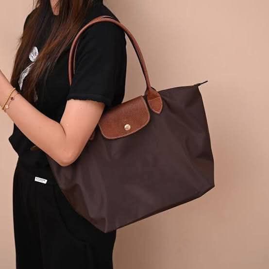 Longchamp Le Ebony Long Shoulder Bag (Category: Luxury Bags & Wallets) located in Camiling. Submitted by marjoriemanuel (Listing ID 1447716504, Image 3). Description: Best seller Lc ebony restock❤️ medium Php 5,500 large longhandle Php 6,500 available onhand & ready to ship limited stocks only.