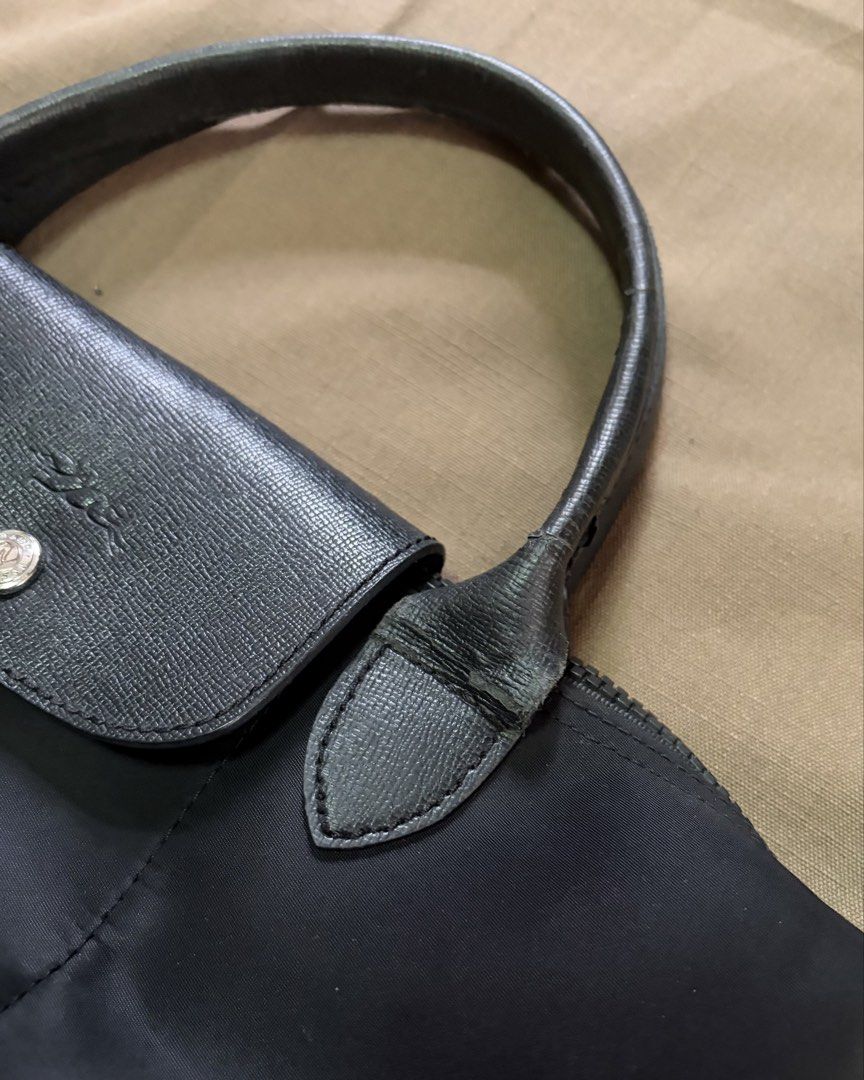 Longchamp Le Pliage Neo Small in Black (Category: Shoulder Bags) located in Quezon City. Submitted by xmanarchive (Listing ID 1447711126, Image 3). Description: - 8/10 condition; Leather handles have visible wear/chipping from normal use (shown in photos) - Nylon body with leather flap and handles - Needs cleaning Send an offer and let’s talk about it.