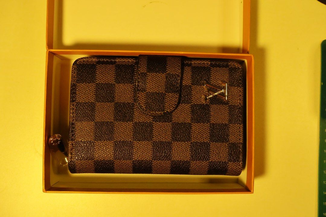 Louie Vuitton Bifold wallet, card holder (Category: Luxury Bags & Wallets) located in Manila. Submitted by kalebvinluan (Listing ID 1447689804, Image 2). Description: Louis Vuitton Compact Zip Wallet in Damier Ebene canvas. Main Bifold Section: Snaps shut and contains slots for cards and a large horizontal compartment for paper bills. Zippered Compartment: A separate area with an all-around zip that typically contains two gusseted sections for co
