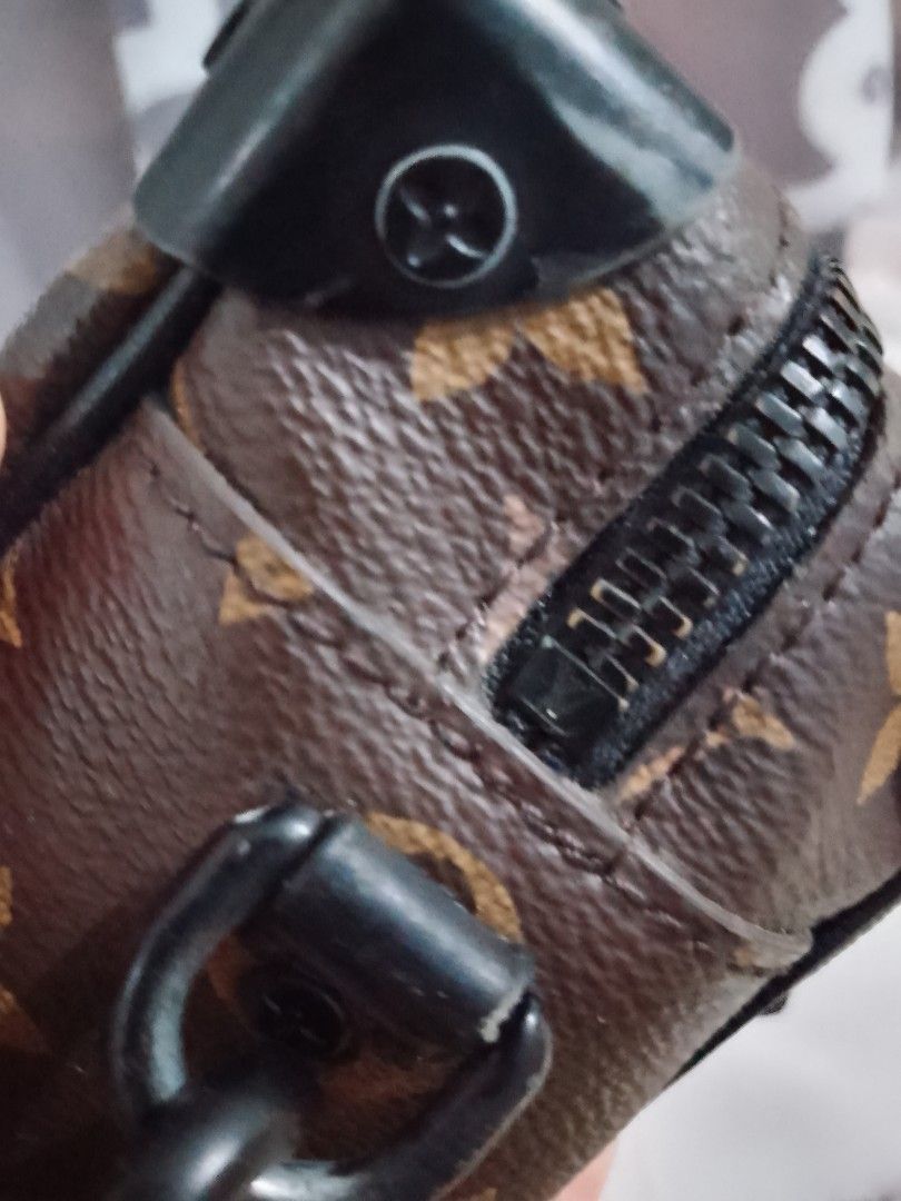 Louis Vuitton Monogram Mini Soft Trunk Crossbody Bag (Category: Luxury Bags & Wallets) located in Carmen. Submitted by badkiss_coffee26 (Listing ID 1447748963, Image 2). Description: - Pre-owned Louis Vuitton crossbody bag - Classic Monogram canvas - Sleek black hardware - Eye-catching orange chain strap - Small and compact, ideal for carrying essentials - Authenticity can be verified - Purchased in 2019.