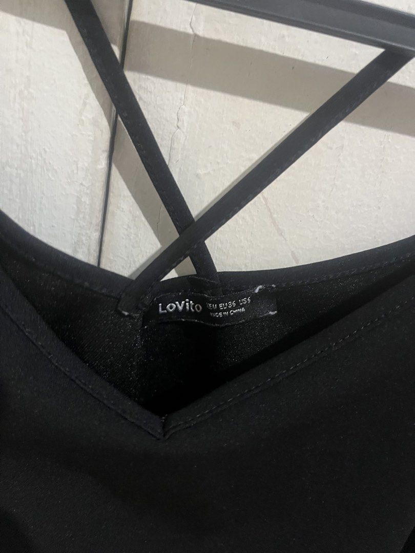Lovito Black Cami Top with Criss-Cross Straps (Category: Sleeveless) located in Manila. Submitted by thelineshopp (Listing ID 1447740139, Image 2). Description: - Lovito black cami top - Features a chic criss-cross strap design at the back - Versatile piece, great for layering or wearing on its own - Effortlessly pairs with any bottoms.